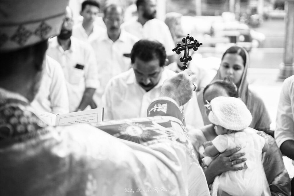priest performing baptism ritual